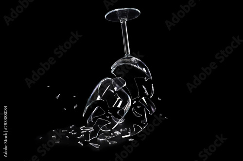 Broken wine glass on black background. Conceptual image.