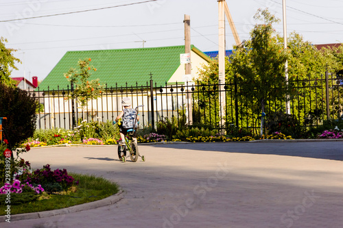 a little boy is riding a bicycle