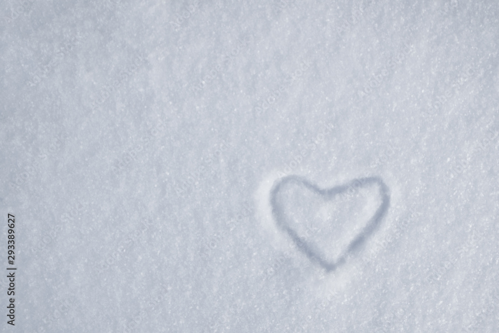 white heart on snow in a snowdrift