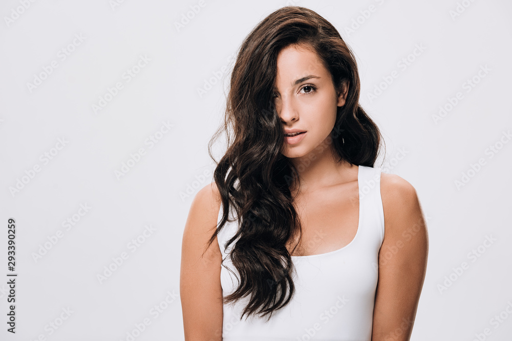 brunette beautiful woman with long healthy and shiny hair isolated on grey brunette beautiful woman with long healthy and shiny hair isolated on grey