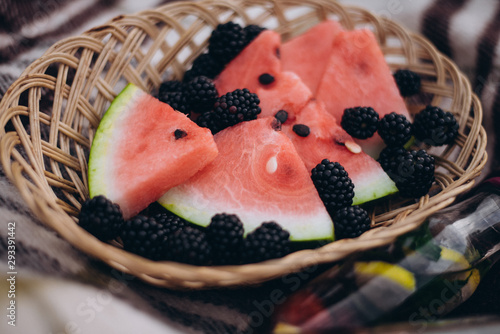 pieces watermelon and blackberry  in basket