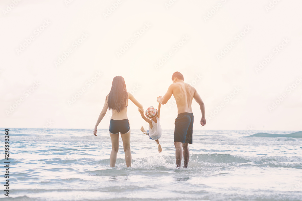 family playing and walking in sea and beach at summer family playing and walking in sea and beach at summer