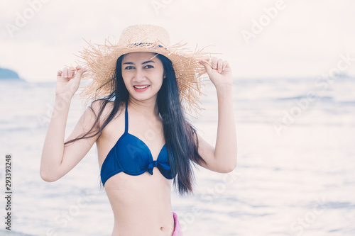 young woman relaxing and enjoying with water sea on the beach © only_kim