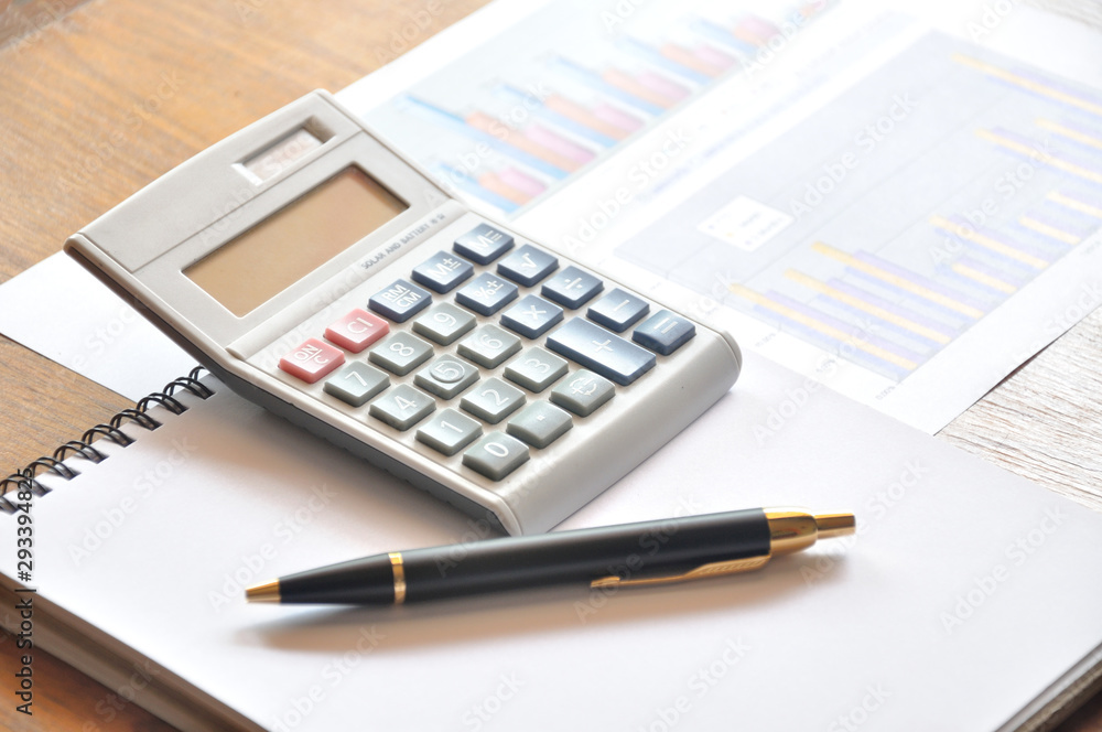 calculator and graph paper with business concept calculator and graph paper with business concept