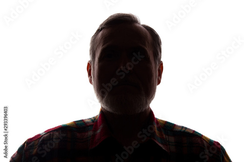 Portrait of a old man, front view - dark isolated silhouette