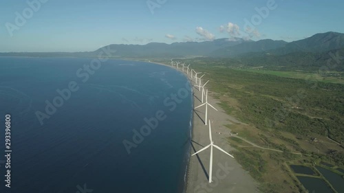 Aerial view of wind turbines for electric power production on the seashore. Bangui Windmills in Ilocos Norte, Philippines. Ecological landscape: Windmills, sea, mountains. Pagudpud