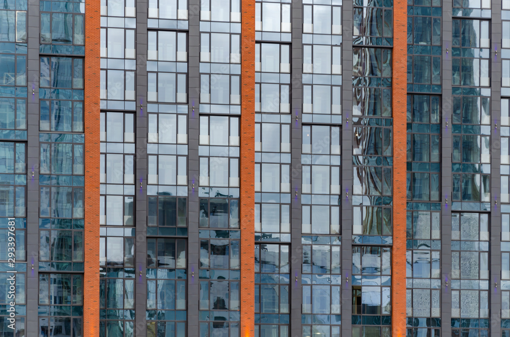 The facade of a multi-storey building of glass and concrete. The facade of a multi-storey building of glass and concrete.
