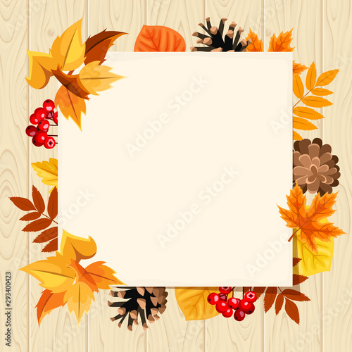 Vector paper card with colorful autumn leaves, rowanberries and pinecones on a wooden background.