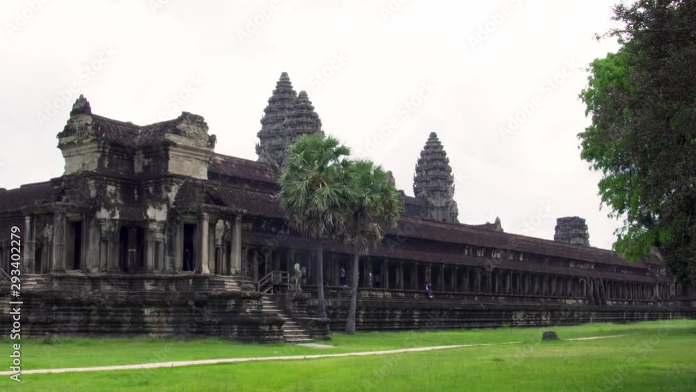 Closeup of Angkor Wat temple, Cambodia. Slider motion with grass and trees. Closeup of Angkor Wat temple, Cambodia. Slider motion with grass and trees.
