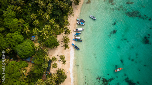 topdown view of a beautiful beach with boats and palm trees in Phu Quoc, Vietnam