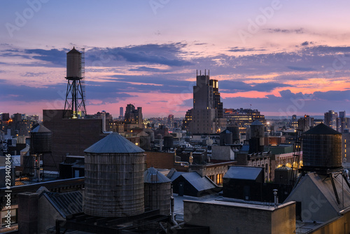 Chelsea rooftops at twilight with water towers. Manhattan, New York City