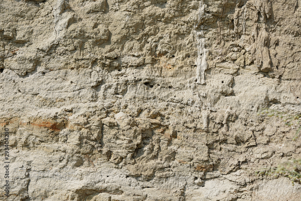 Texture of different layers of clay underground in a clay quarry. clay wall background close up