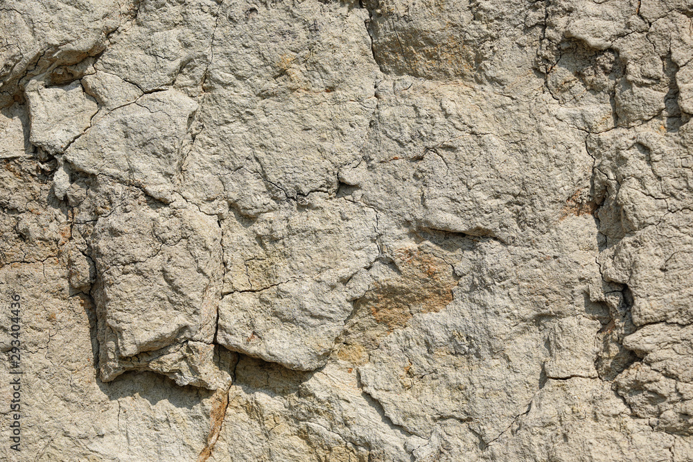 Texture of different layers of clay underground in a clay quarry. clay wall background close up Texture of different layers of clay underground in a clay quarry. clay wall background close up