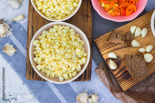 Cooked white corn kernels in bowl. Vegan lunch or vegetarian dinner.