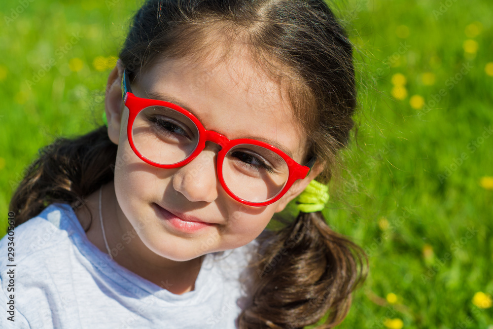 Summer. Open space. Portrait of a girl. The girl is wearing glasses. Summer. Open space. Portrait of a girl. The girl is wearing glasses.