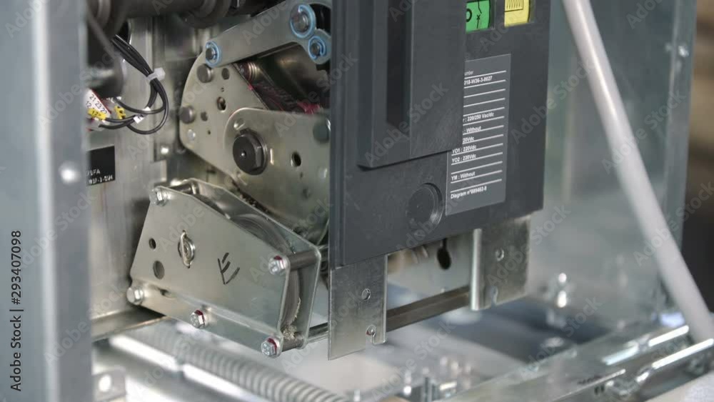 Gear motor recharges the spring in vacuum Automatic circuit breaker, fuses in a big industrial electric rack Gear motor recharges the spring in vacuum Automatic circuit breaker, fuses in a big industrial electric rack