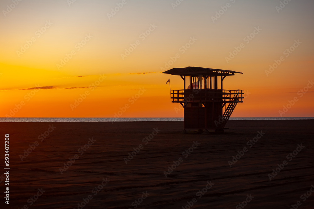 Lifeguard tower at sunset on the beach of Poti in Georgia. Amazing sunset