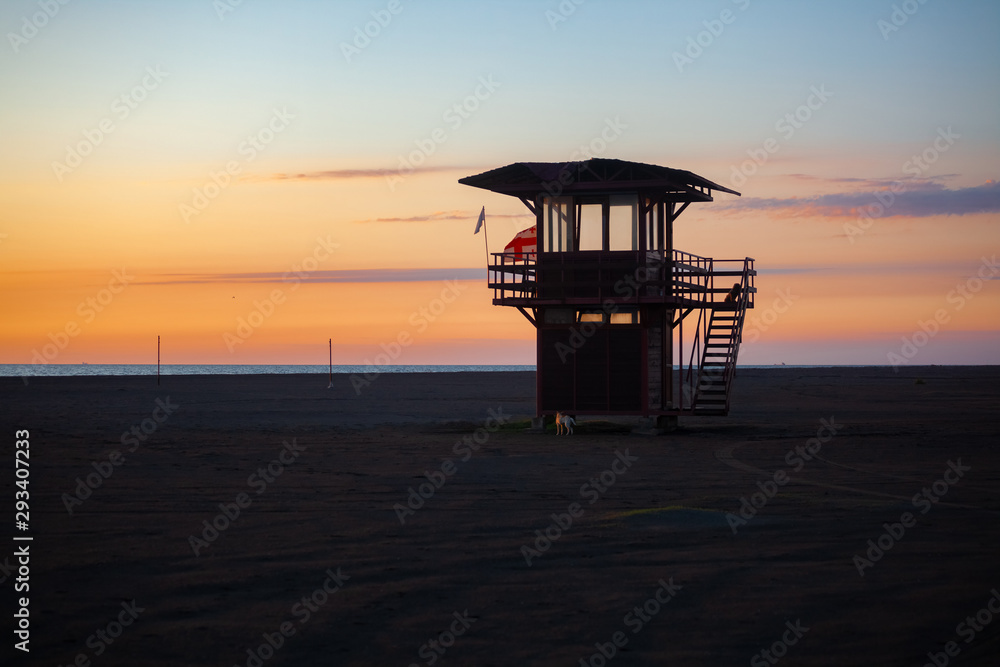 Lifeguard tower at sunset on the beach of Poti in Georgia. Amazing sunset Lifeguard tower at sunset on the beach of Poti in Georgia. Amazing sunset