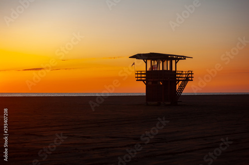Lifeguard tower at sunset on the beach of Poti in Georgia. Amazing sunset © k_samurkas