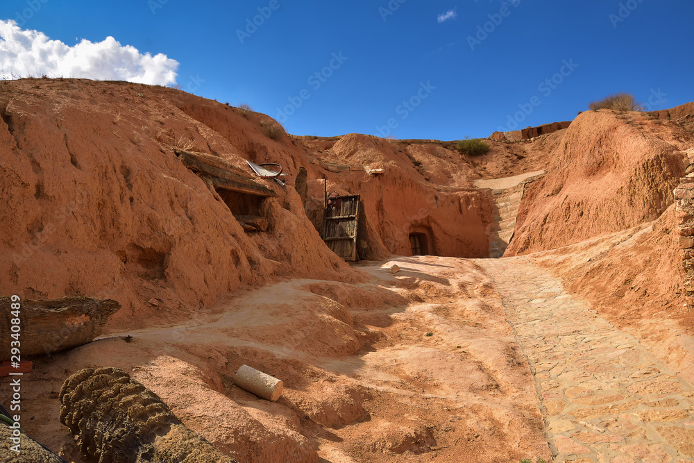 troglodyte dwelling, cave dug in the ground on a mountain slope