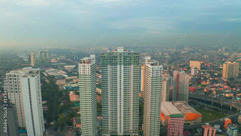 Modern building sunrise skyline background in Manila city, Philippines. Aerial 4K Modern building sunrise skyline background in Manila city, Philippines. Aerial 4K