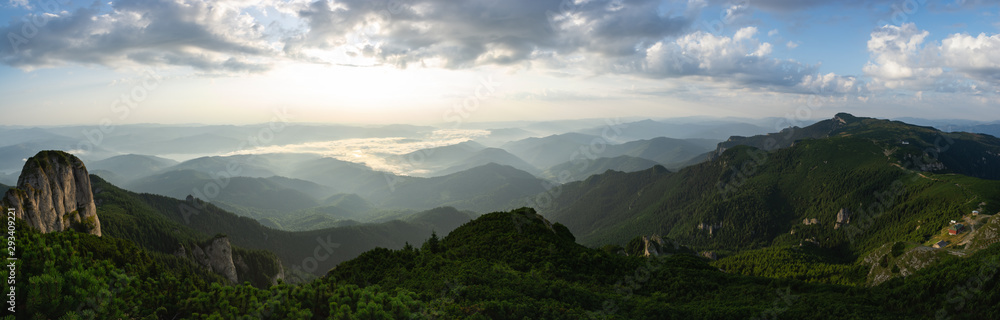 Fototapeta premium Beautiful panoramic view of Eastern Carpathians and Lake Izvorul Muntelui at sunrise, Romania