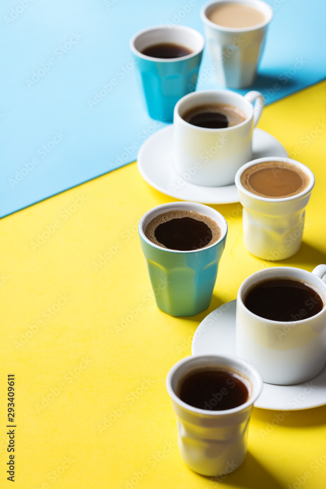Creative flat lay with assortment of coffee cups Creative flat lay with assortment of coffee cups