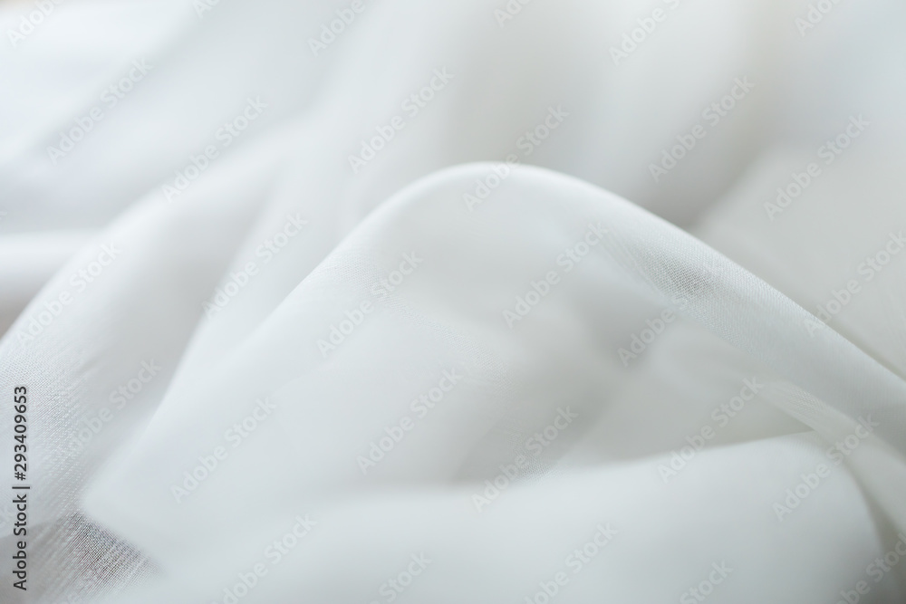 Close up of white linen cloth . Texture and fabric background or wallpaper.