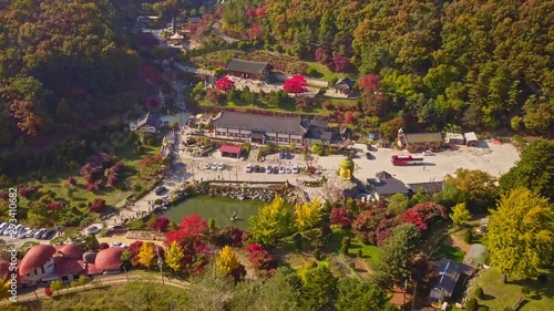 Aerial video of autumn season at Waujeongsa temple located in Yongin city, South Korea. photo