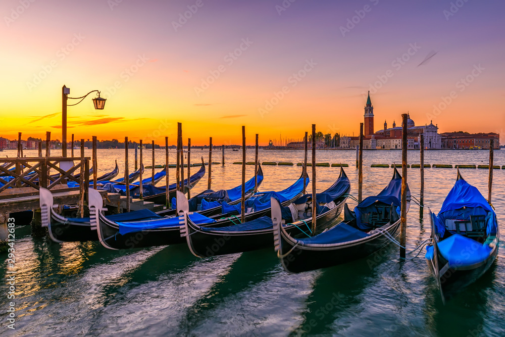 Sunrise in San Marco square, Venice, Italy. Architecture and landmarks of Venice. Venice postcard with Venice gondolas