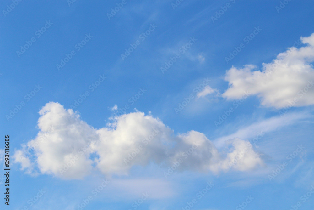Clouds in the blue sky on a nice bright sunny weather on a summer day