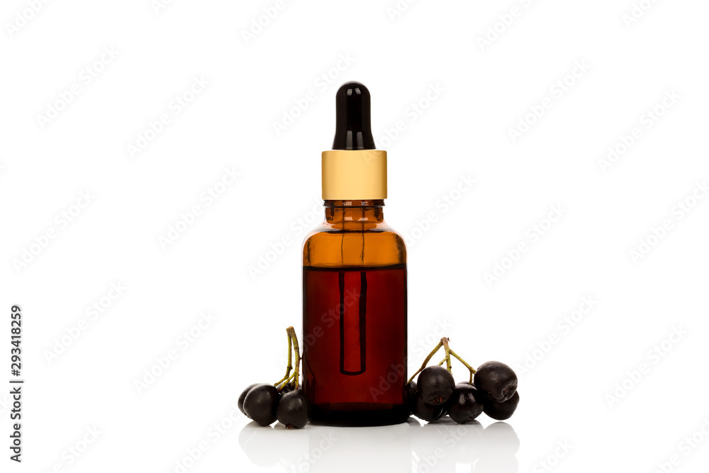 Bottle with fresh acai fruit.