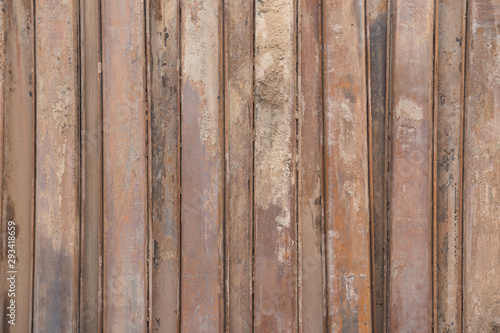 rusty metal sheet pile wall background and texture. steel retaining wall for site construction.