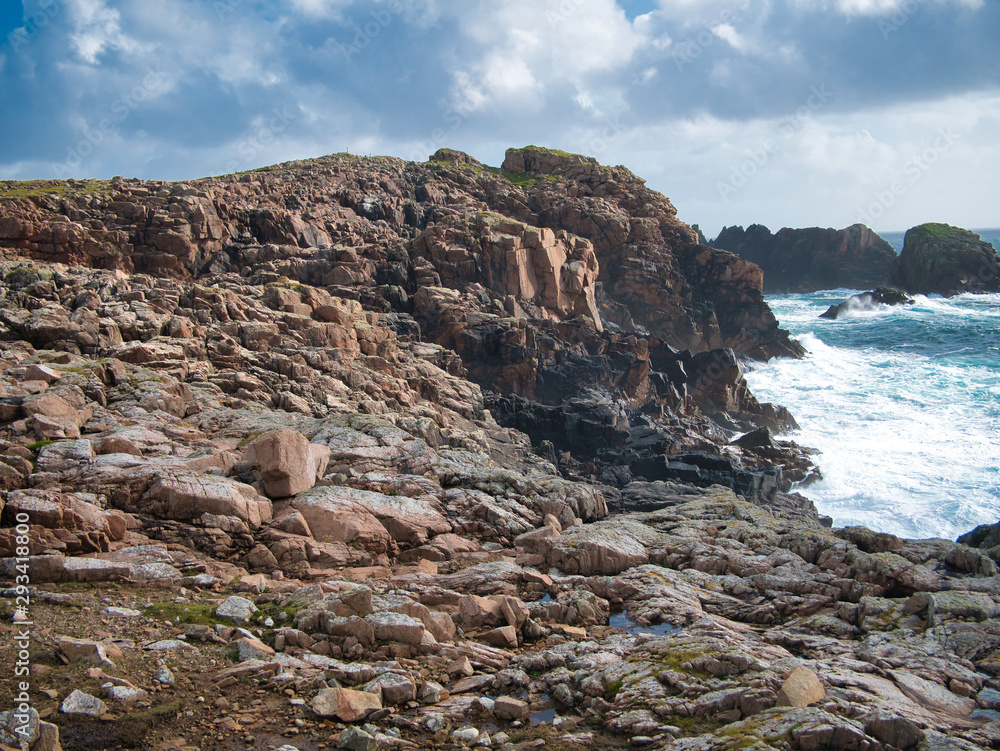Fototapeta premium Coastal debris among eroded rocks, near Culswick on Mainland, Shetland, UK