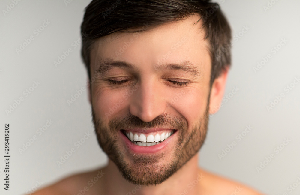 Middle Aged Man Smiling With Closed Eyes In Studio Middle Aged Man Smiling With Closed Eyes In Studio