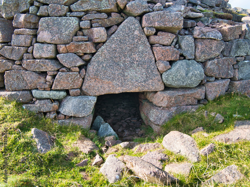 The massive triangular lintel stone over the entrance of the isolated ...