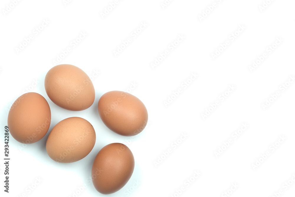 Top view four brown eggs separated from the white background with space for writing. Top view four brown eggs separated from the white background with space for writing.