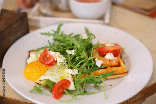 Belgian waffles with salad and eggs