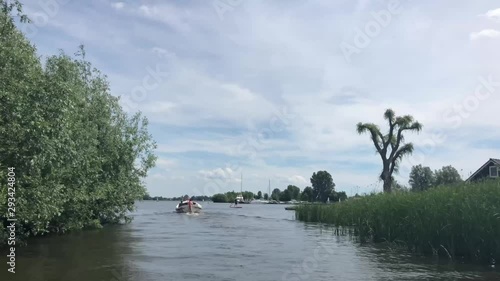 Boats on a lake in Friesland, The Netherlands photo