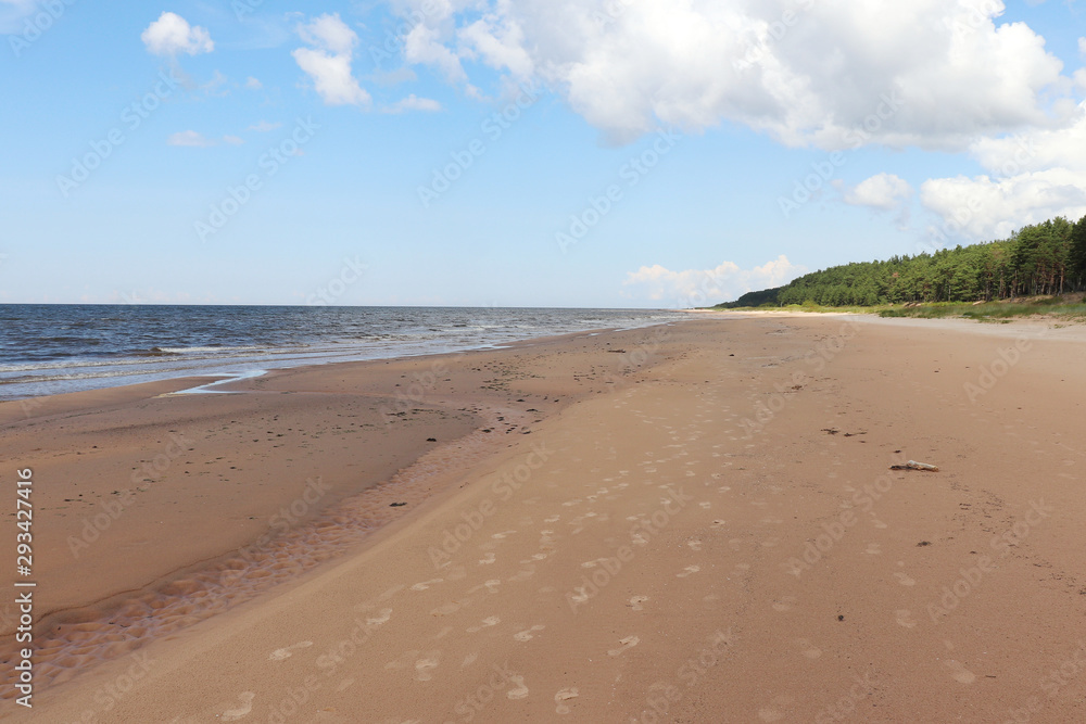 Footprints on a beach at the Baltic Sea in Latvia
