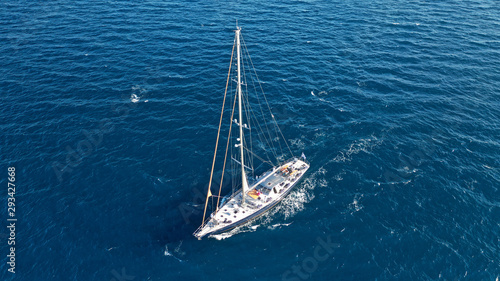 Aerial photo of sail boat cruising the Mediterranean deep blue sea © aerial-drone