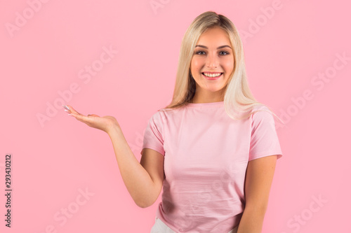 beautiful young woman on pink background with hand gesture