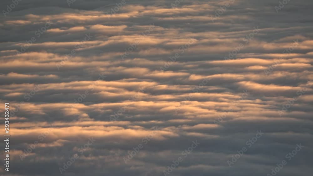 Well lit sea of inverted clouds moving below camera point of view Well lit sea of inverted clouds moving below camera point of view
