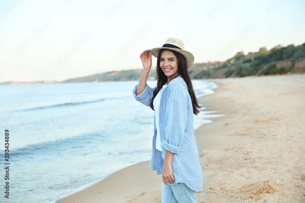 Beautiful young woman in casual outfit on beach Beautiful young woman in casual outfit on beach