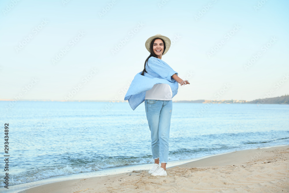 Beautiful young woman in casual outfit on beach Beautiful young woman in casual outfit on beach