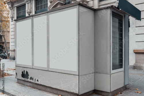 Blank canvas white outdoor banner at Newsstand with newspapers and magazines
