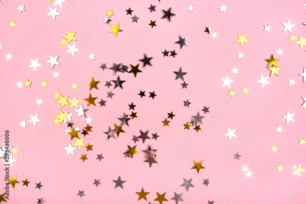 Golden and silver stars on pink pastel background.