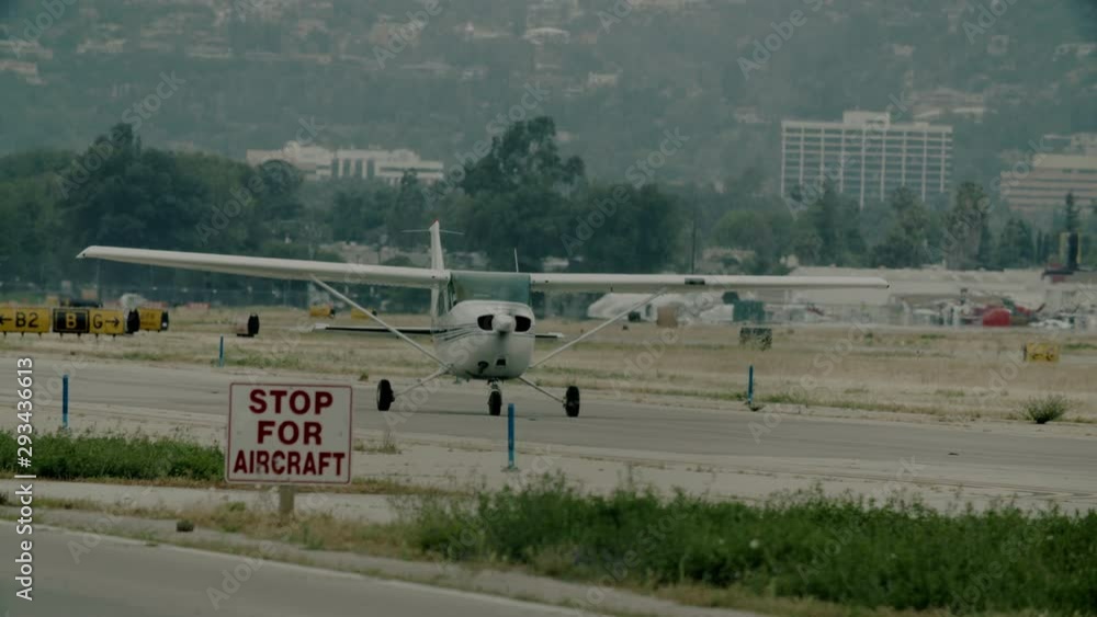 Small generic private propeller airplane preparing for take-off. 60 FPS Slow Motion, 4K RAW graded footage