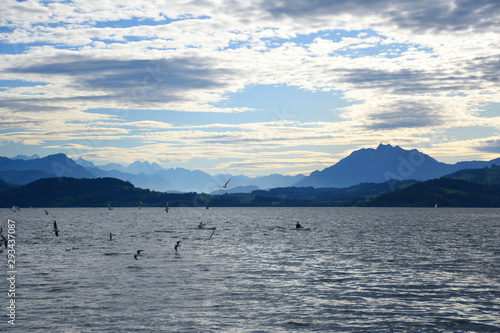 Landscape view of Lake Zug with cirrus clouds and mountains in the distance