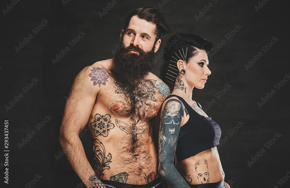 Fototapeta premium Young attractive man couple is posing for photographer at photo studio.